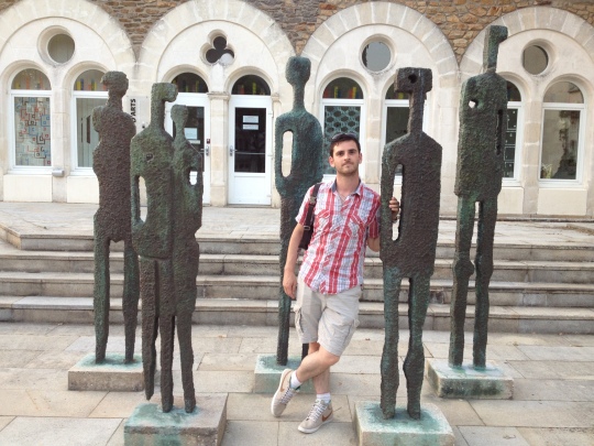 Max posing with inedible statues